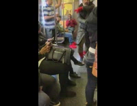 Man breakdances on the floor to Smooth Criminal Michael Jackson song on metro train