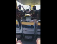 Lady holds doll with long blonde hair 