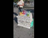 Spontaneous poems and handmade penis shaped candles stand