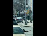 Guy does ab exercises on pedestrian light
