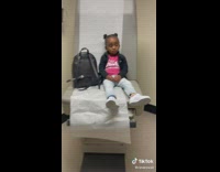 Little girl pink shirt says she feels sick