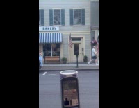 Man with bag zesty sidewalk video shoot