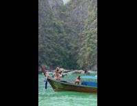 Woman red bikini kneel pose on boat