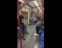 Guy lays on floor and rolls out of subway train when doors open 