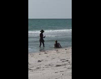 Woman in bikini crawls and removes hair extension