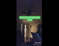 Girl sings song she wrote dark room