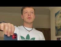 Guy lipstick drops phone red wig jumpsuit 