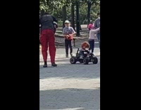 Chucky doll rides black remote controlled car