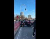 Collab WINY - Man rides vehicle and bumps the pink fence