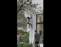 Woman grey leggings climb hang on pillar