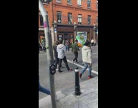 Woman hold irish flag middle of street