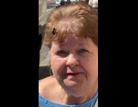 Elderly woman with bee on hair 