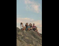 Three girls sit rock selfie guy talk murder