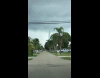 Girl sees tornado clouds forming in distance 