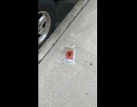 Opened Biohazard specimen bag on the sidewalk