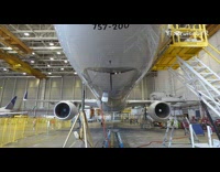 White airplane plane drops wheels hangar garage