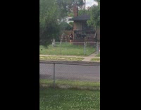 Black shirt girl twerks brown house yard