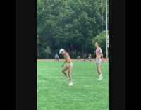 Two men shirtless jump rope park music