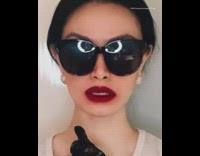 Girl black sunglasses red lipstick coronavirus symptom 
