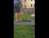 Black white checkered shorts golf practice 