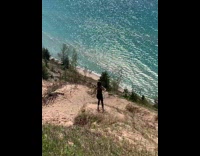 Girl t pose one leg stand cliff