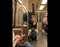 Random guy rides subway hangs on handrail