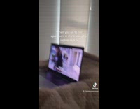 Girl using laptop as tv in bed 