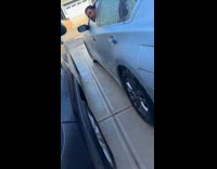 Man pokes head through car window ice 