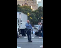 Collab WINY - Police cop smokes cigarette while direct people 