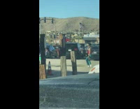 Man cross dress poses at the parking lot