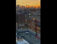 New york skyline at sunset and guy riding segway unicycle