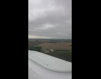 Guy stands on a wind turbine windmill 