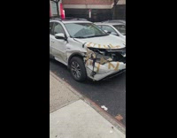 Trashed Car with Brown Tape Patches on Valet