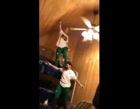 Guy jumps bunk bed hits ceiling fan 