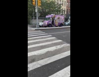 Ice cream truck in traffic playing music loudly