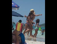 Guy takes selfie in front of beach