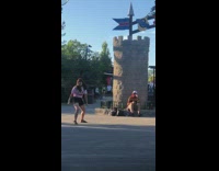 Pink shirt girl dances fake castle tower 