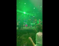 Guy falls forward into plants at concert 