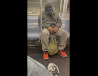 Asleep Man with LED Cap Snores Loudly