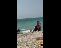 Woman bikini kneel beach friends hold reflector part 3