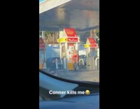 woman in red photoshoot gas station