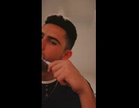 Black shirt guy brushes teeth white dog 