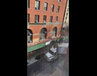 Part 1 Fire fighters on top of big rig that hit side of building