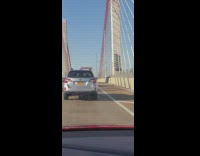 SUV drives through pedestrian side of bridge 