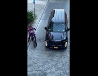 Man on bike sing with microphone street