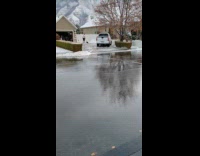 Man sees guy scrapes snow wears crocs