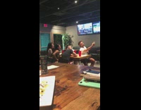 Customers group picture red glass restaurant television