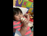 Toddler Plays with Milk and Spits it