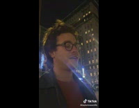 Couple walks by two circles with messages 