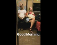 Woman holding pink polka dot neck pillow falls asleep on subway train